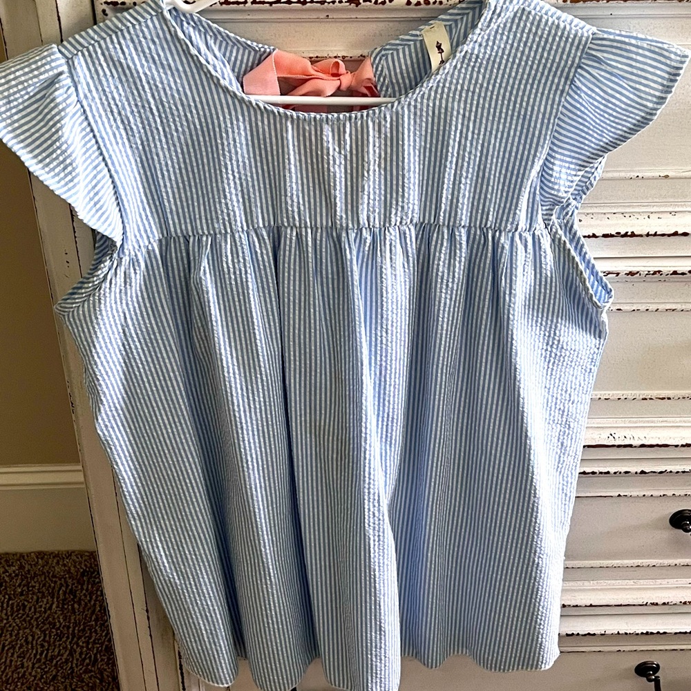 Blue searsucker boutique top with pink bow detail